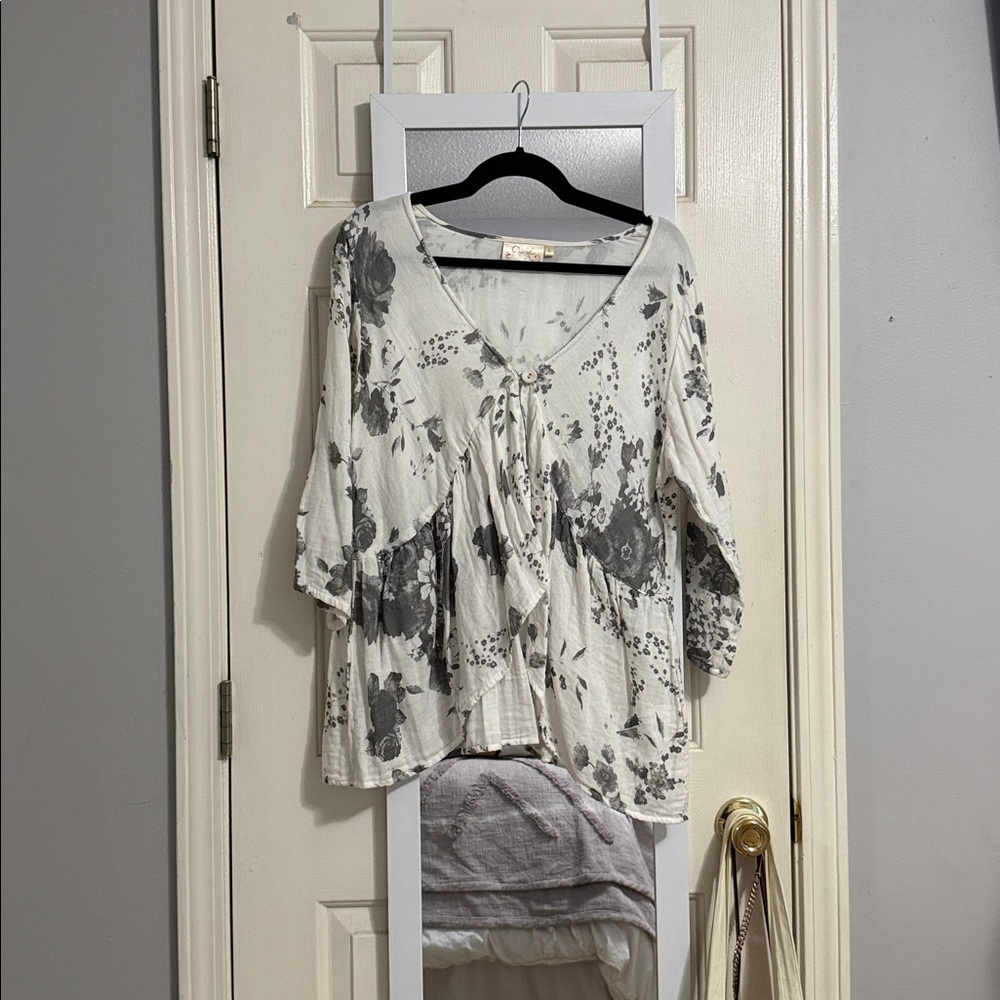 A floral top with a button to tie it all together!